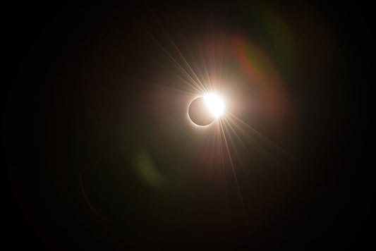 A dramatic view of the 2017 total solar eclipse in eastern Oregon, capturing the “diamond ring” effect as sunlight bursts past the moon’s edge.